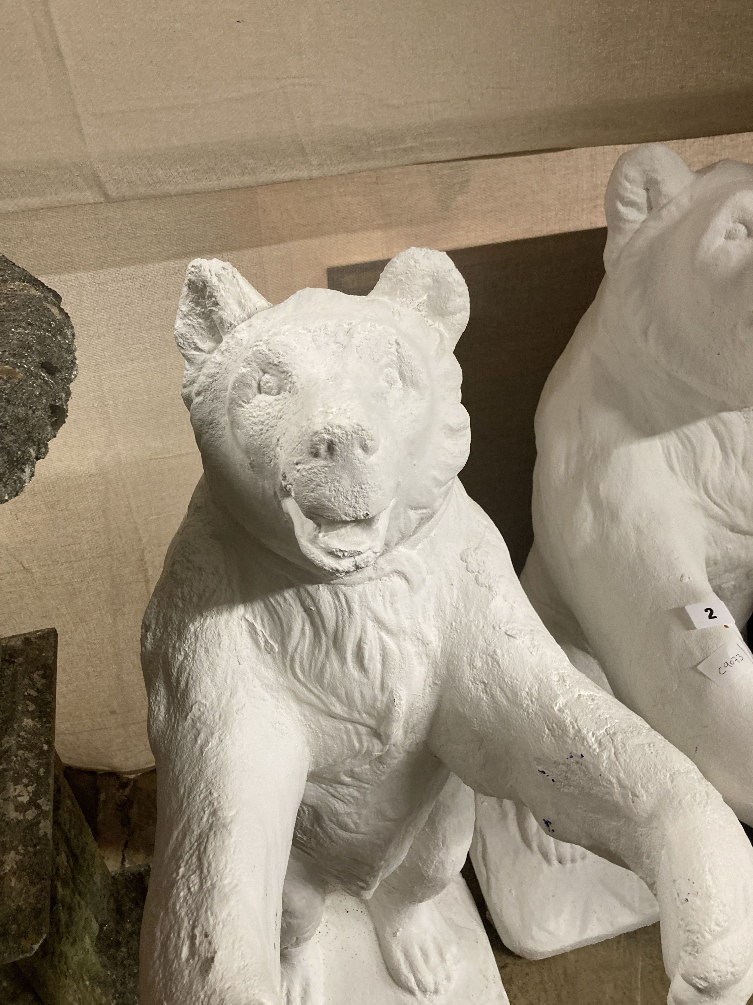 A pair of painted bear reconstituted stone garden pot holders, 97cm high